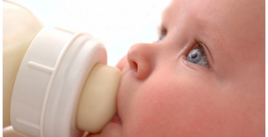 Baby drinking milk from a bottle